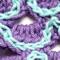 A close up of a scale on the purple scarf option.